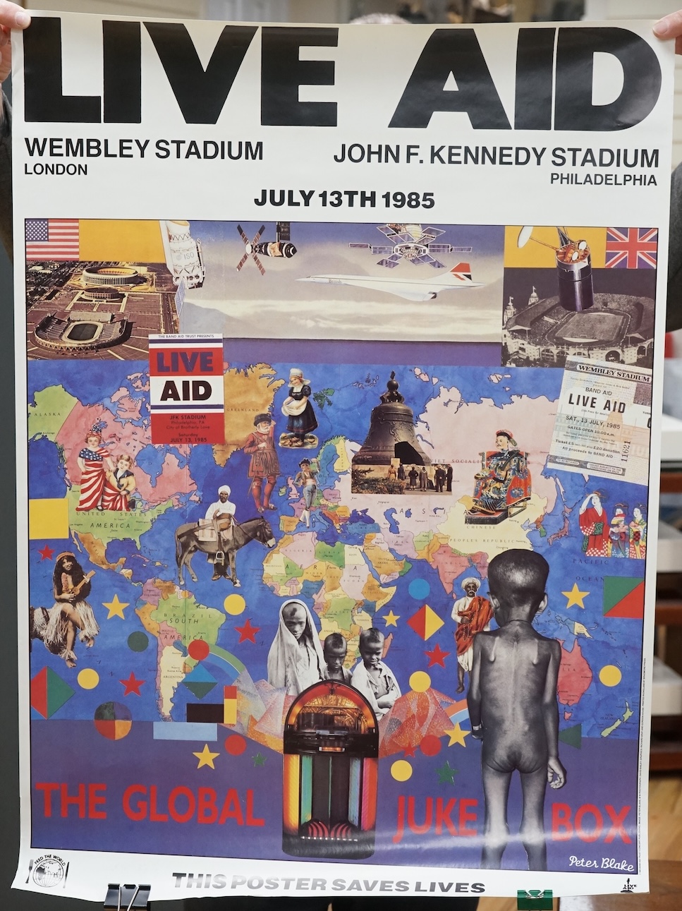 An original Live Aid poster, dated July 13th, 1985, and promoting the concerts at Wembley Stadium London, and John F. Kennedy Stadium Philadelphia, designed by Peter Blake, with photography by David Bailey and printed in